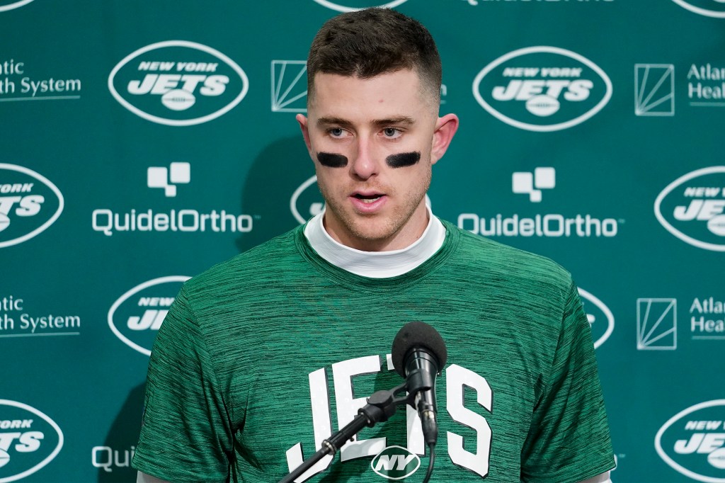 Mike White speaks to the media following the Jets' loss to the Seahawks in January 2023.