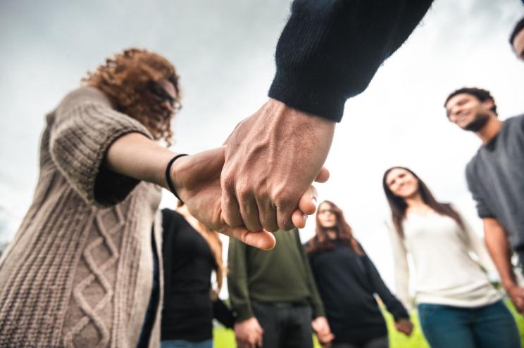 diversity concept - holding hands