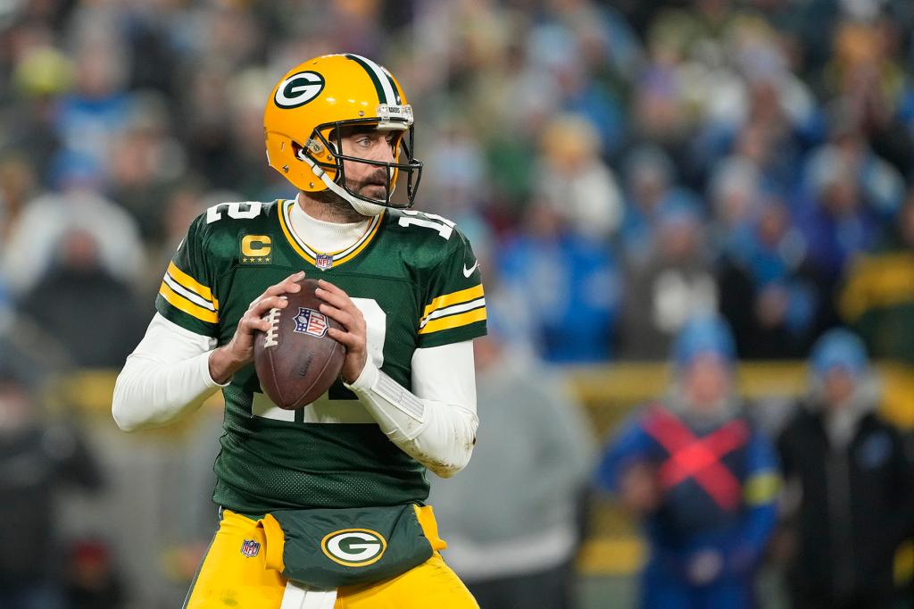 Aaron Rodgers #12 of the Green Bay Packers looks to the throw the pass against the Detroit Lions in the second half at Lambeau Field on January 08, 2023 in Green Bay, Wisconsin.