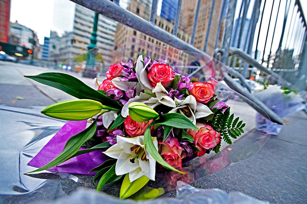 Flowers are left for the victims of the West Side bike path attack.