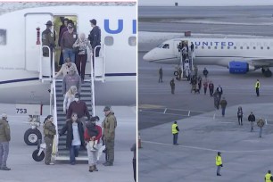 Passengers being removed from a United flight after a threat was discovered