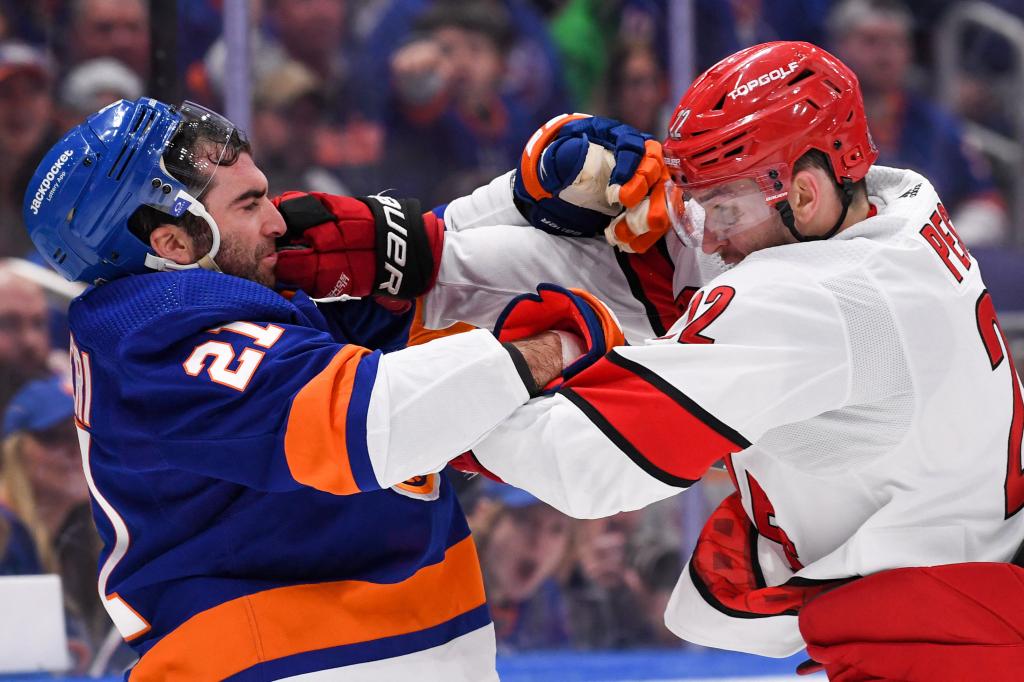 Kyle Palmieri (21) and Brett Pesce fight during the Islanders' Game 3 win over the Hurricanes on April 21.