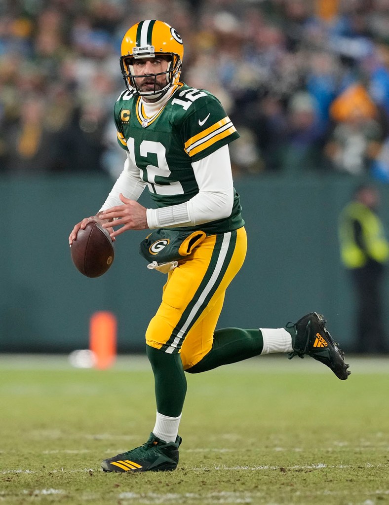 Aaron Rodgers #12 of the Green Bay Packers looks to throw a pass against the Detroit Lions in the first half at Lambeau Field on Jan. 8, 2023 in Green Bay, Wisconsin.