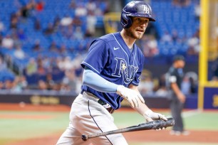 Brandon Lowe looks to the Tampa Bay dugout after hitting a solo home run in the unbeaten Rays' 7-2 win over the Red Sox.