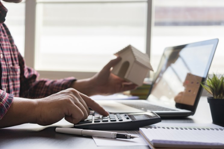 A man looks at his property taxes on his laptop.