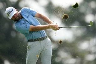 Cameron Young hits his tee shot on the fourth hole during the first round of the Masters.