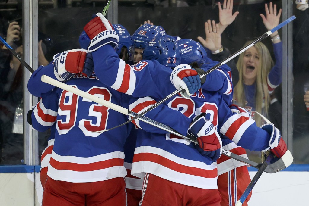 Chris Kreider is mobbed by Rangers teammates after scoring the game-tying goal late in the first period of the Devils' Game 6 loss.