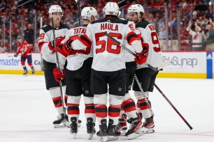 The Devils celebrate Miles Wood's second period-goal during their 5-4 overtime victory over the Capitals.