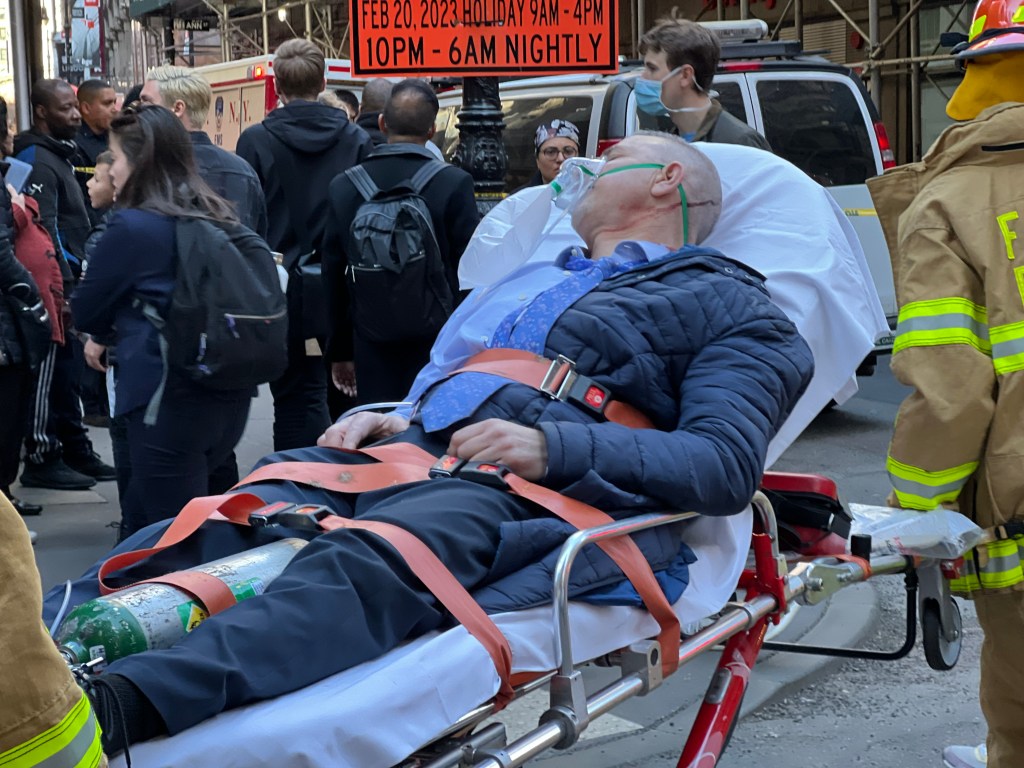 A victim is seen on a stretcher