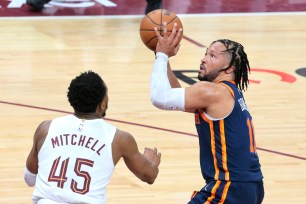 Jalen Brunson, who scored 27 points, shoots over Donovan Mitchell during the Knicks' 101-97 Game 1 win over the Cavaliers.