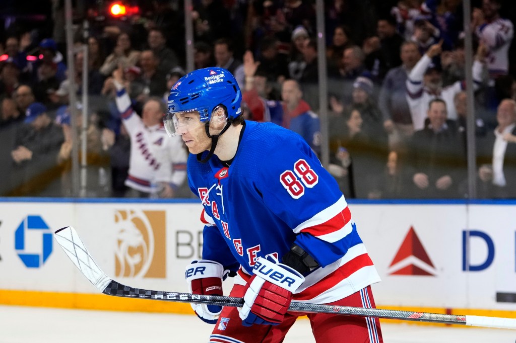 Rangers' Patrick Kane (88) skates toward his bench after scoring a goal