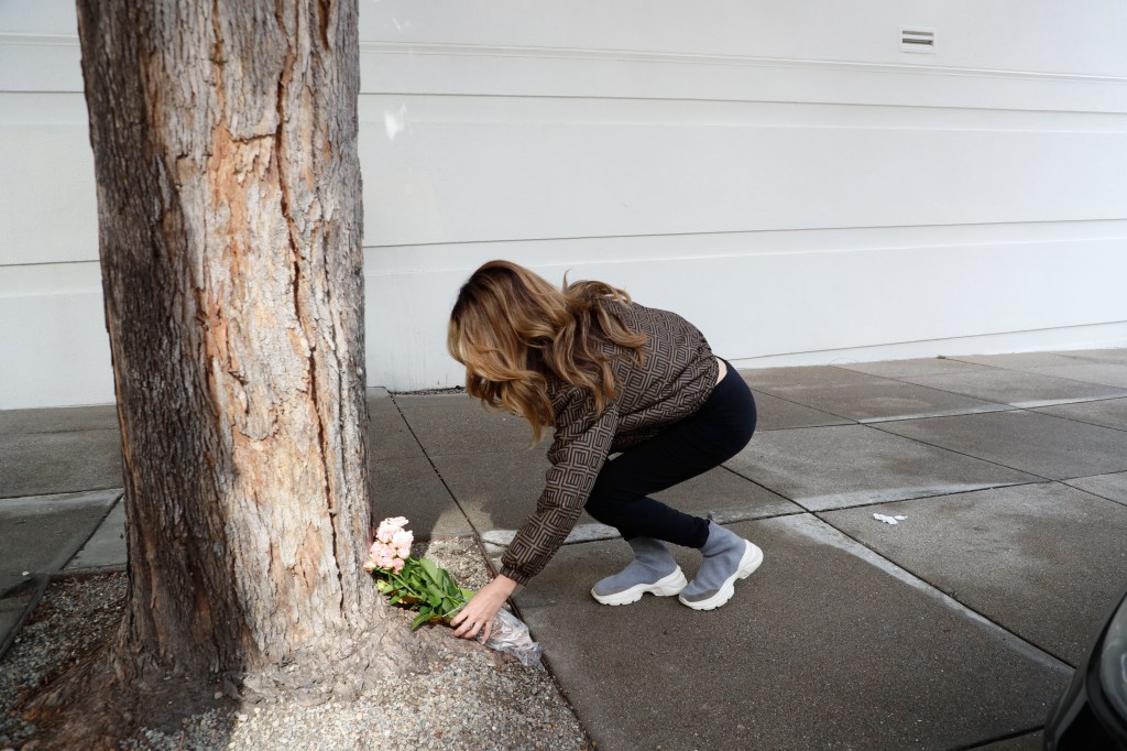 Mourner Soha Zadeh leaving flowers near where Lee was stabbed to death.