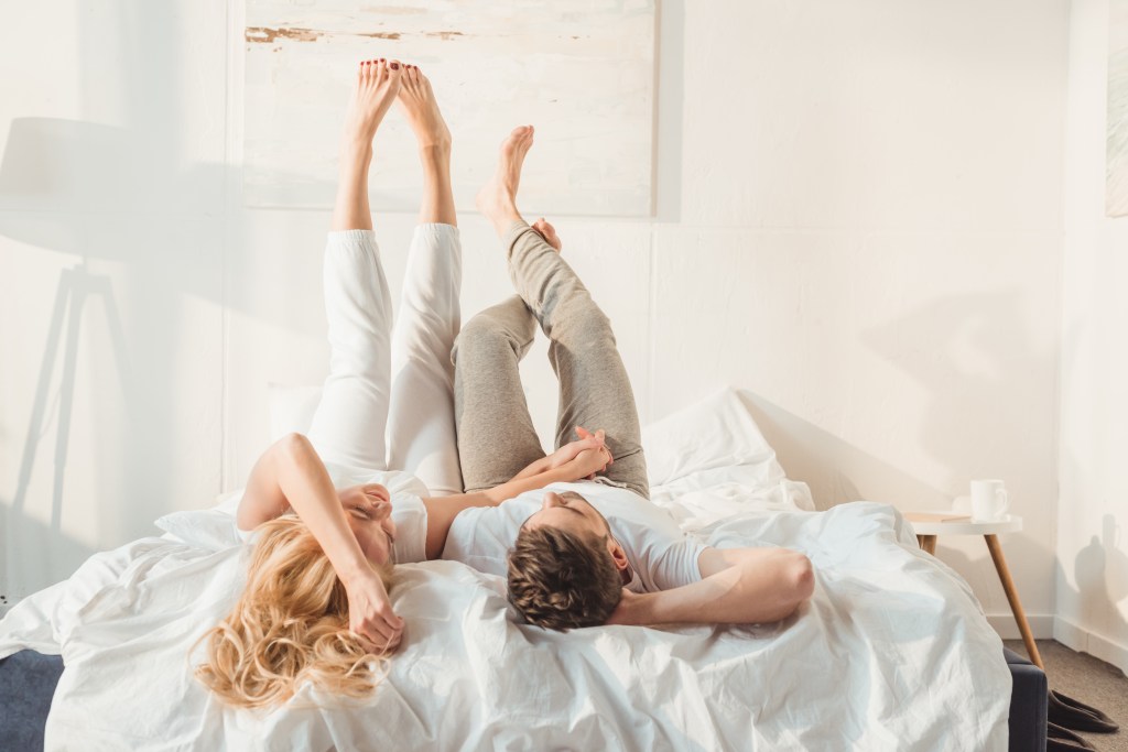 Couple laying in bed