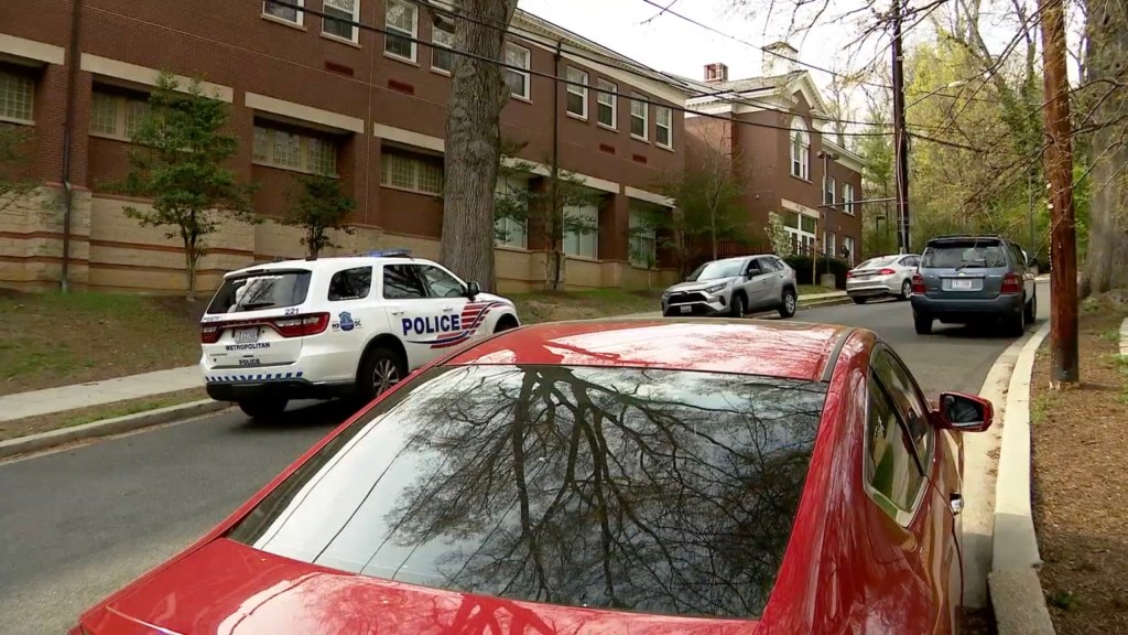 shot of the school with cop car outside