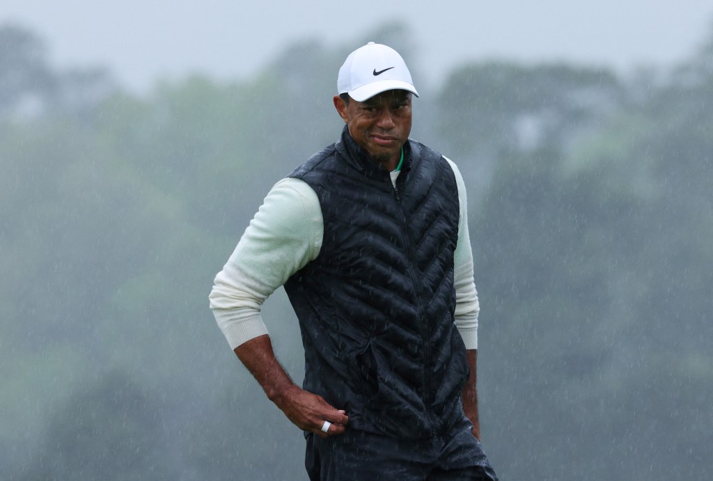 Tiger Woods battles the rain at The Masters on April 8. 