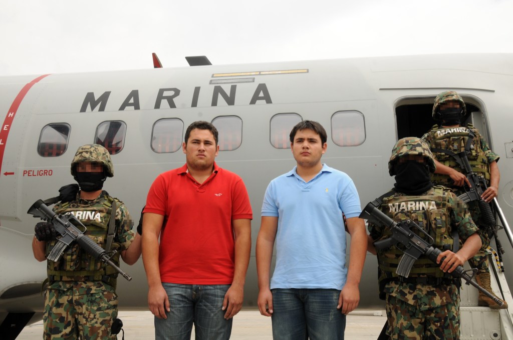 Accused drug traffickers escorted by marines in Mexico City.