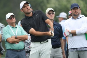 Scottie Scheffler hits an approach shot into the 17th hole during his Masters practice round.