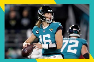 Jaguars quarterback Trevor Lawrence rares back to throw a pass.