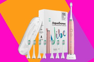 Aquasonic toothbrush on an orange, pink, and purple background.