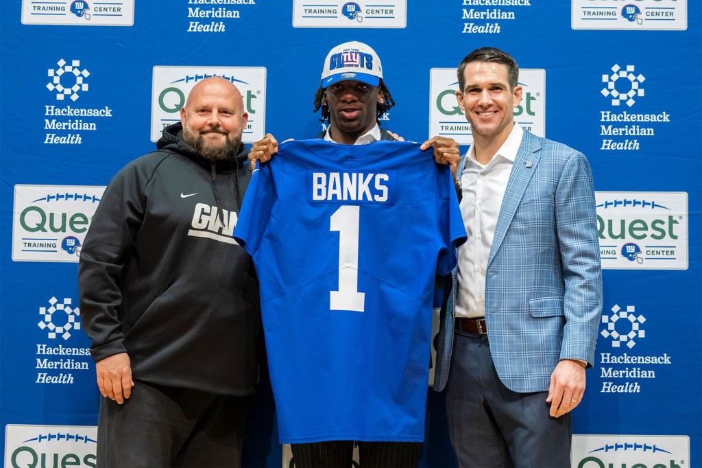 Deonte Banks, Brian Daboll and Joe Schoen all pose with Banks at his introductory press conference.