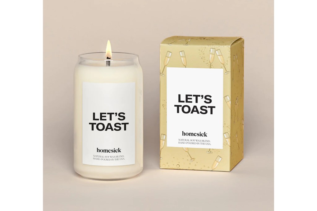 white candle that say's "let's toast"