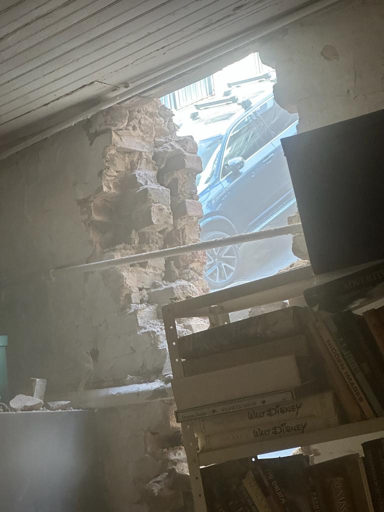 Sandy Imhoff, who lives in an apartment neighboring the collapsed parking garage, provided a photo showing the damage.