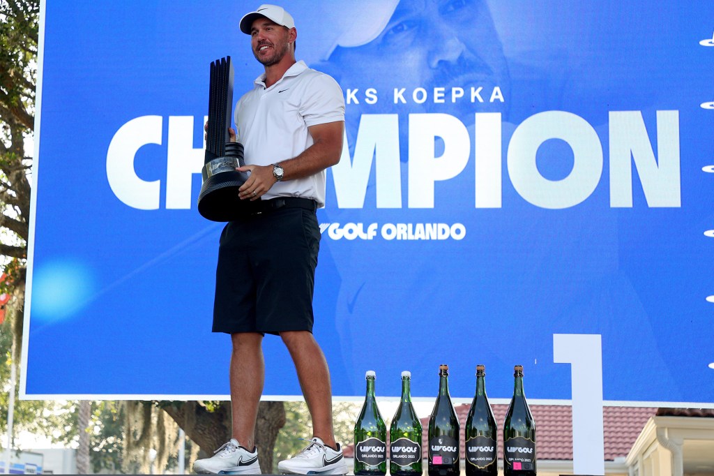 Koepka, who serves as the captain of Smash GC, poses with his trophy on April 2, 2023.