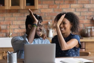 A happy couple is approved for a personal loan