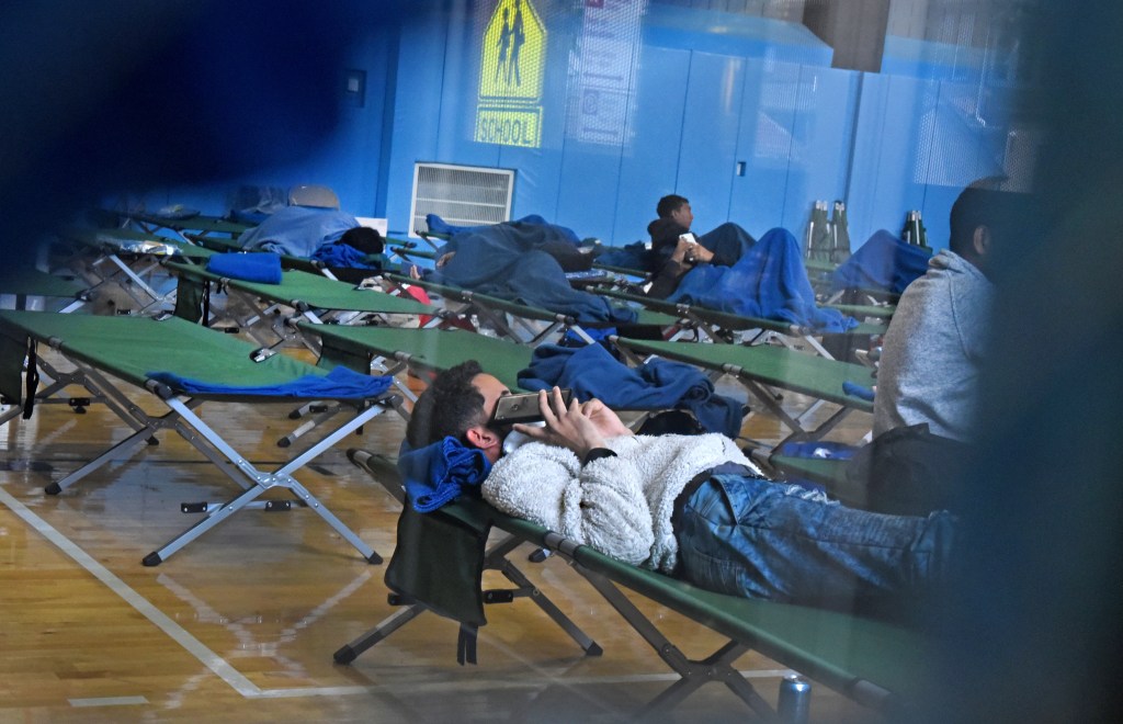 Approximately 75 single men migrating from other countries are being temporarily housed in the Sandra Feldman Gymnasium in Coney Island. 