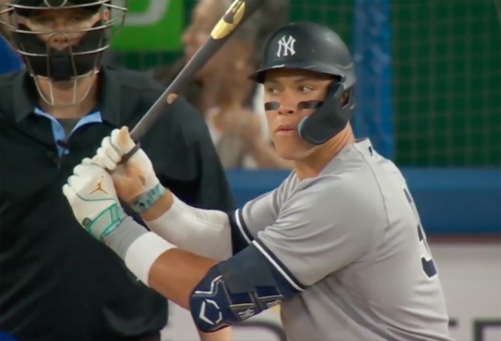 Aaron Judge looks toward the Yankees dugout before hitting a massive home run against the Blue Jays.