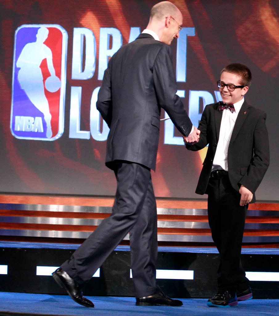 Nick Gilbert (r.) is congratulated by Adam Silver after the Cavaliers netted the top pick in the 2011 NBA Draft.