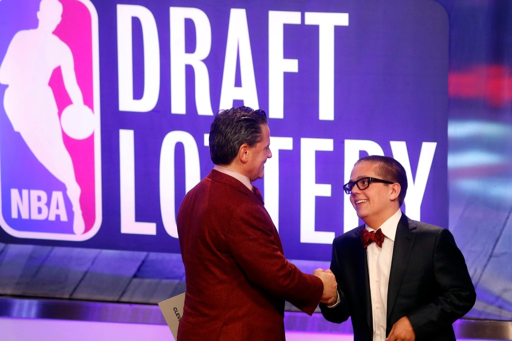 Nick Gilbert (r.) with his father Dan at the 2013 NBA Draft lottery.