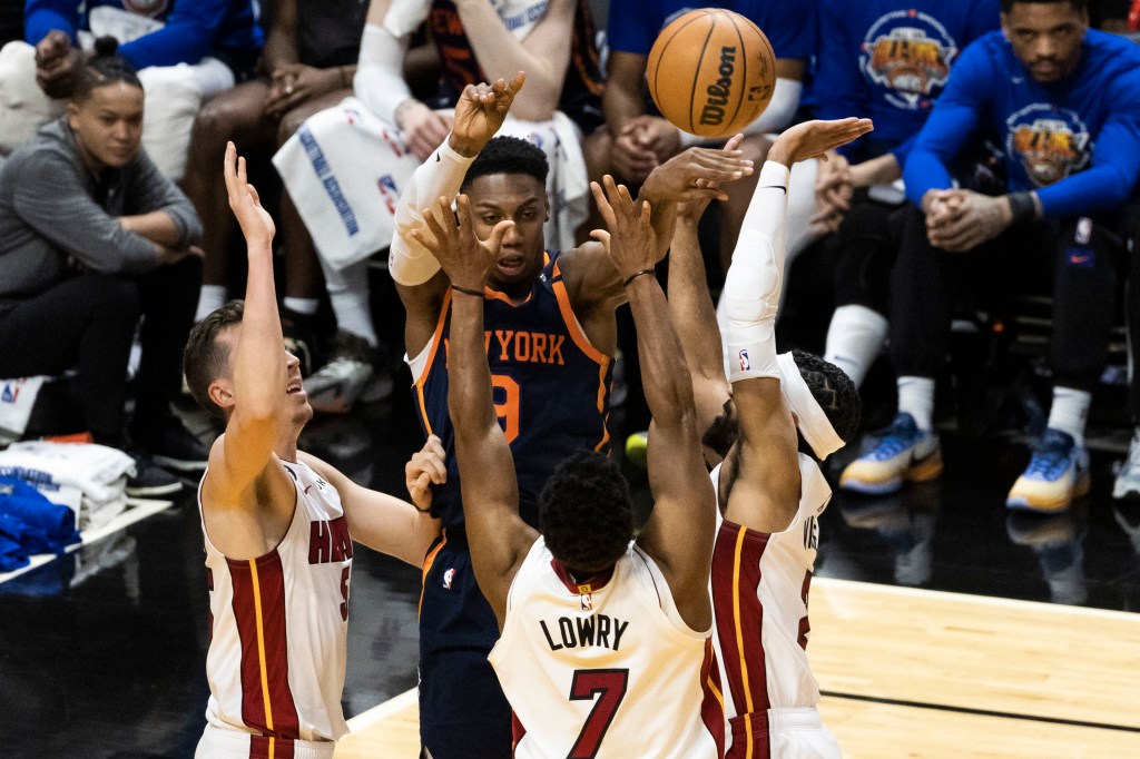 RJ Barrett looks to make a pass over the Heat's swarming defense during the Knicks' loss.