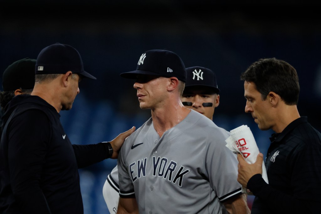 Yankees pitcher Ian Hamilton leaving Tuesday's game against the Blue Jays in the fourth inning with an injury.