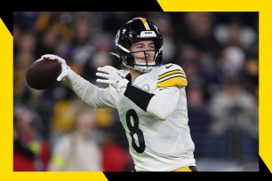 Pittsburgh Steelers quarterback Kenny Pickett drops back for a pass.