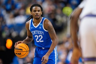 Cason Wallace #22 of the Kentucky Wildcats dribbles the ball 