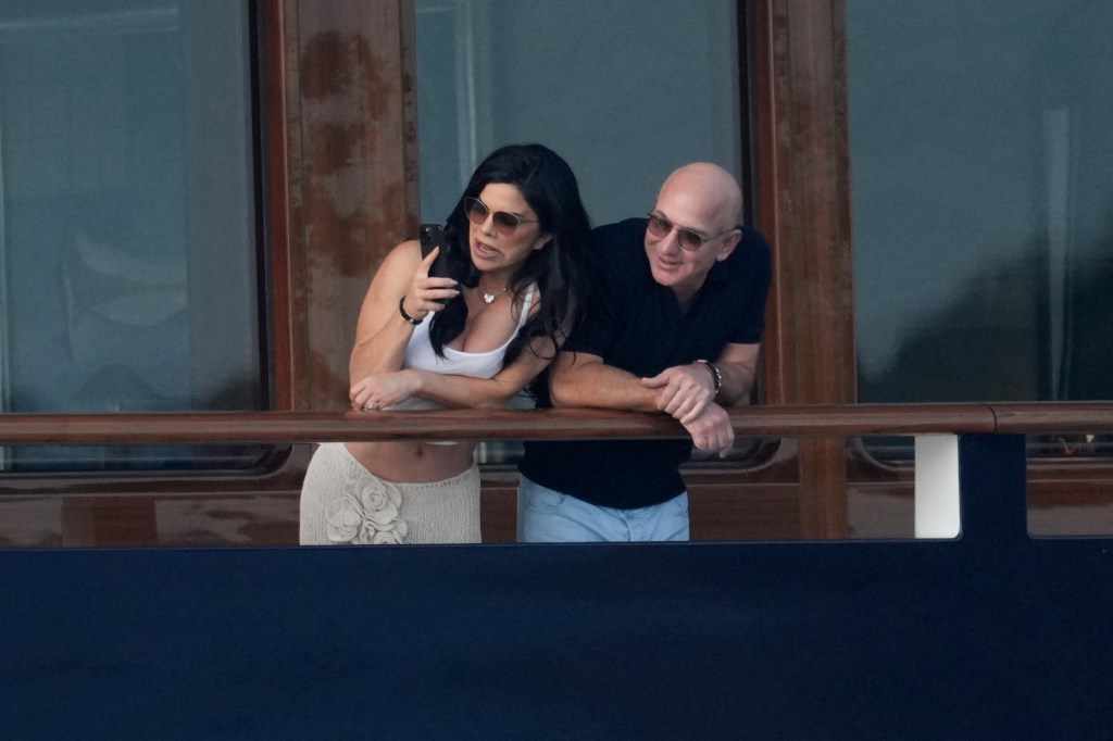 Bezos and Sanchez are photographed aboard his $500 million yacht. 