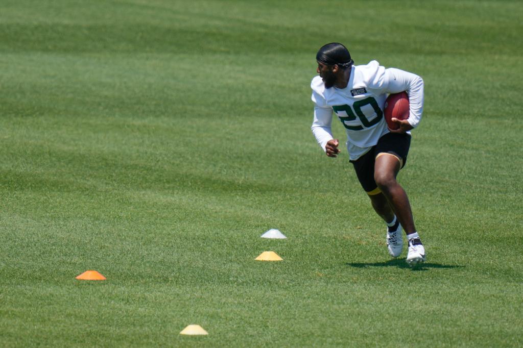 Jets' Breece Hall participates in a drill at the NFL football team's training facility