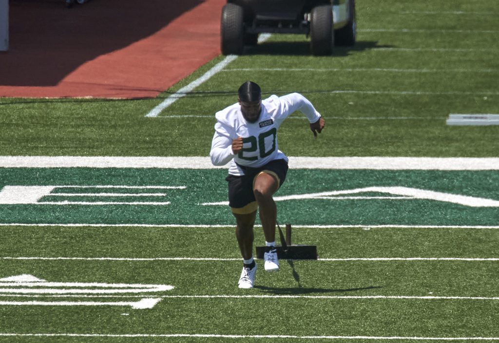 Running back Breece Hall (20) workout during organized team activities