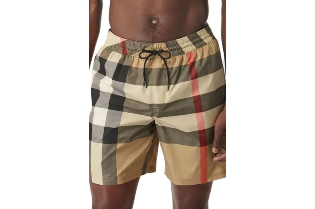 A man in Burberry swims shorts.
