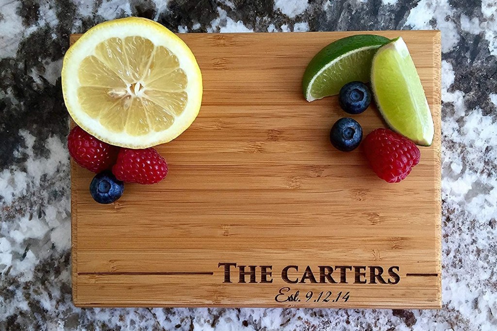 wooden cutting board with fruit on top