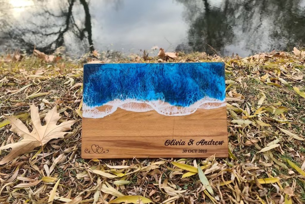 blue resin and wooden cutting board