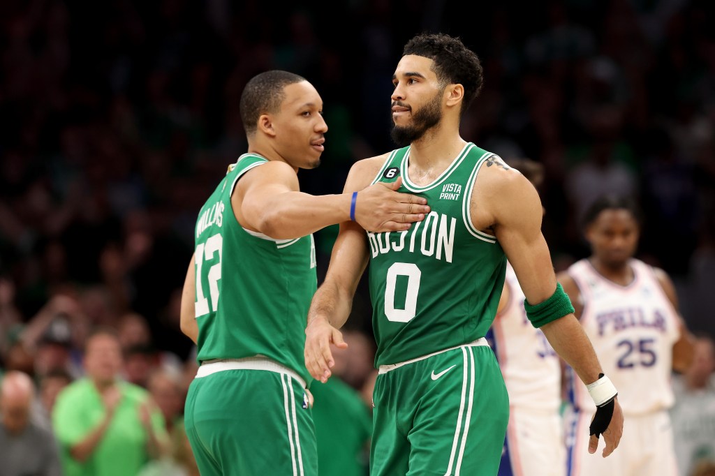 Jayson Tatum and Grant Williams celebrate after beating the 76ers in Game 7