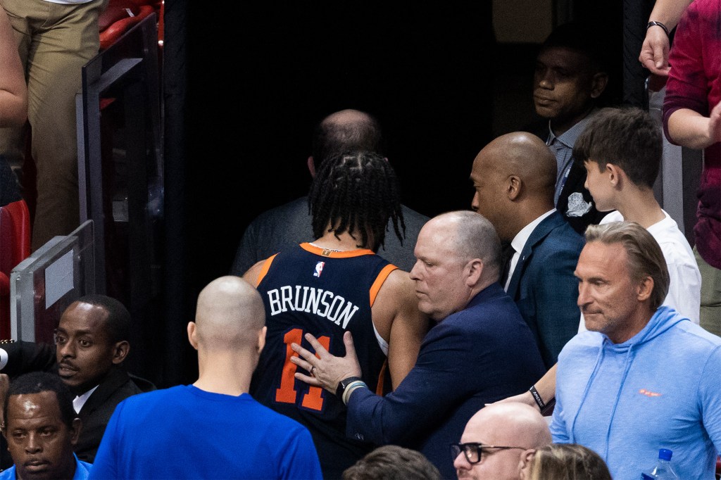 Jalen Brunson and the Knicks exit the court following their Game 6 loss.