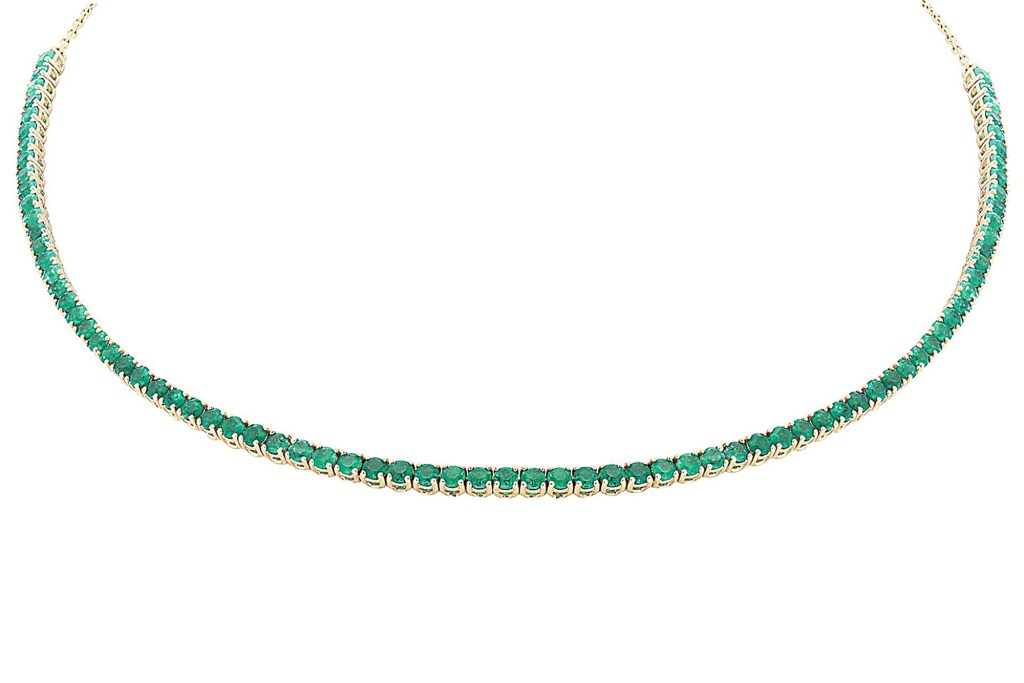 Close up of a London Collection choker in 14-k yellow gold with emeralds.