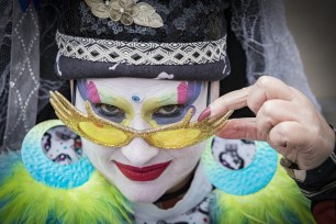 A Sister of Perpetual Indulgence eyes the camera while wearing glorified nun makeup.