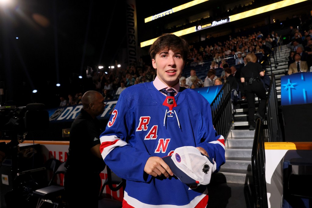 Drew Fortescue celebrates after being selected 90th overall pick by the New York Rangers