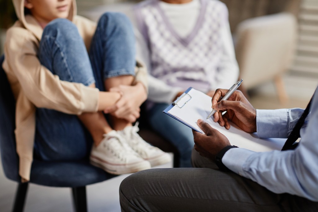 Children sitting with doctor