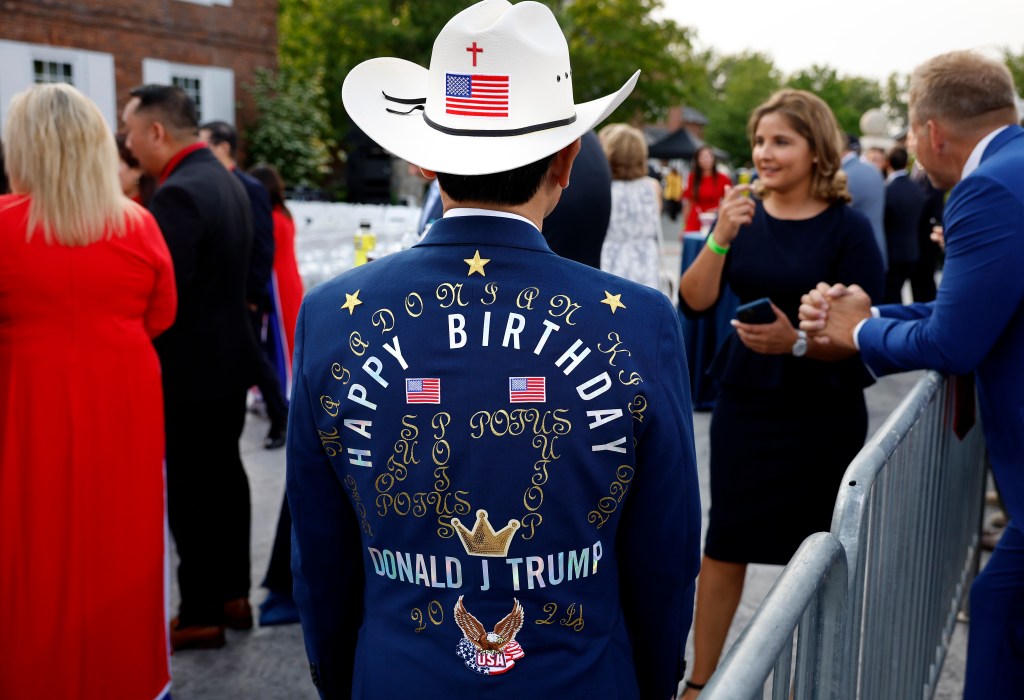 Supporter wears jacket celebrating Trump's birthday.