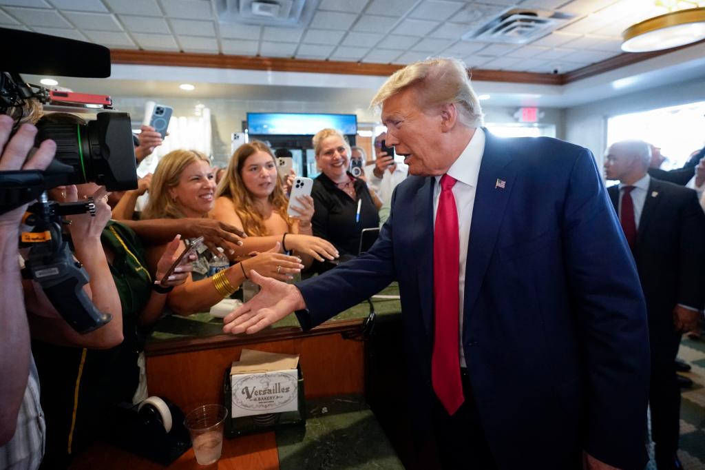 Trump greeting supporters in a Miami Cuban restaurant after his arraignment on June 13, 2023.